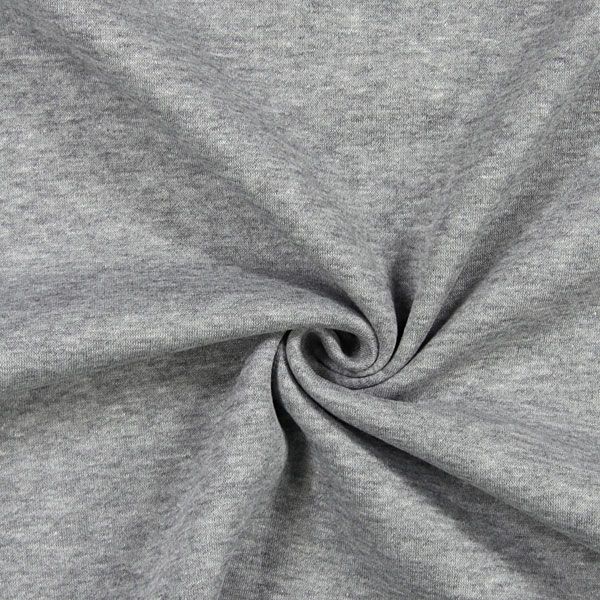 Close-up view of grey fabric with a spiral pattern, highlighting its texture.